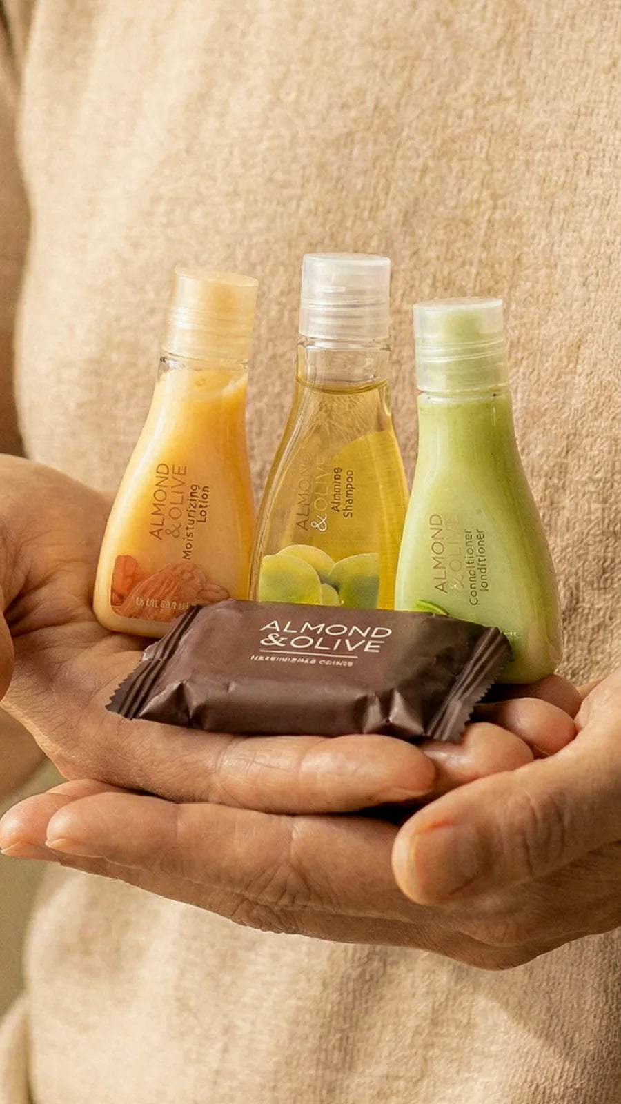 Almond and Olive amenities held in welcoming hands